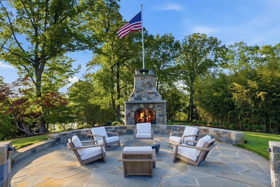 Stone firepit lounge with flag