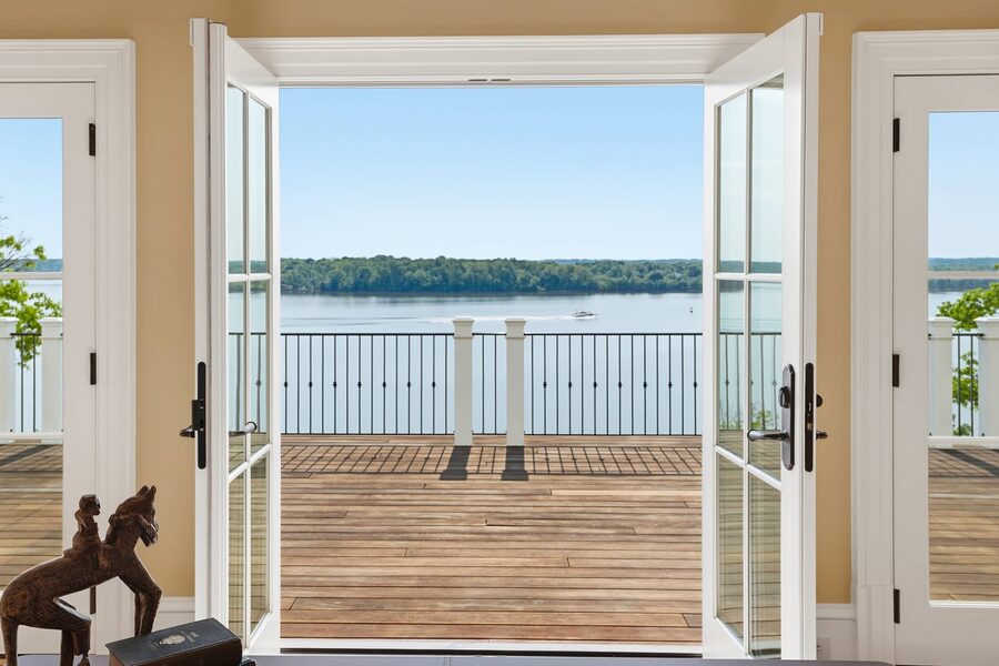French doors opening to the river-view porch
