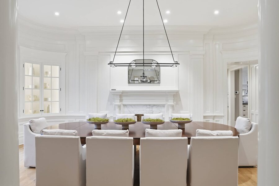 Dining alongside the kitchen, linear chandelier