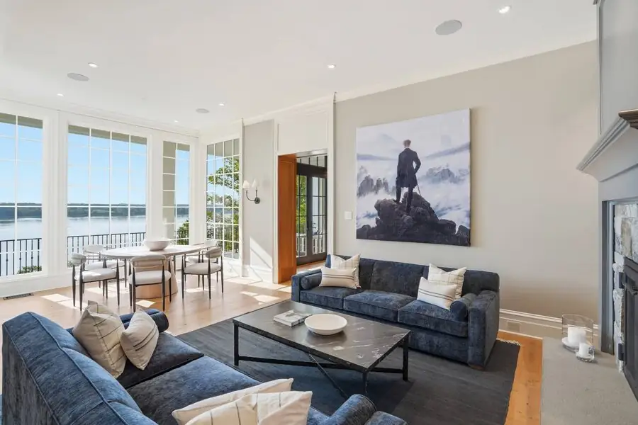 Living room with blue couches and gallery walls
