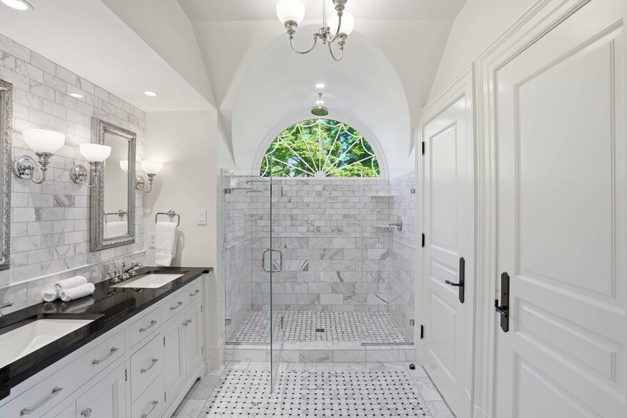 Marble bath with arched walk-in shower